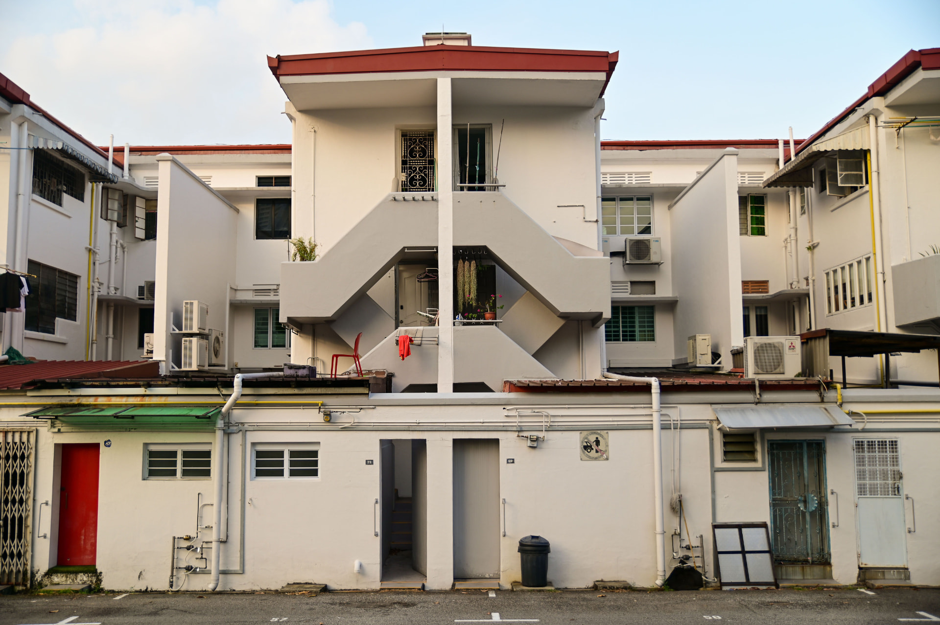 A row of landed terrace houses in a quiet Singapore neighbourhood.